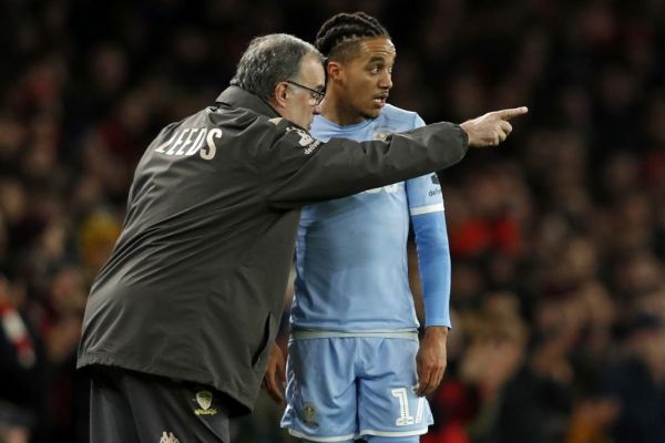 Leeds United's Argentinian head coach Marcelo Bielsa (L) speaks to Leeds United's Portuguese midfielder Helder Costa on the touchline during the English FA Cup third round football match between Arsenal and Leeds United at The Emirates Stadium in London on January 6, 2020. PHOTO | AFP