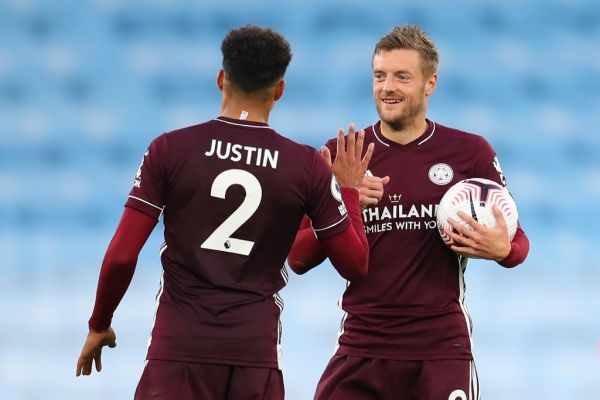 Leicester City's English striker Jamie Vardy walks off with the match ball having scoring a hattrick during the English Premier League football match between Manchester City and Leicester City at the Etihad Stadium in Manchester, north west England, on September 27, 2020. Leicester won the game 5-2. PHOTO | AFP