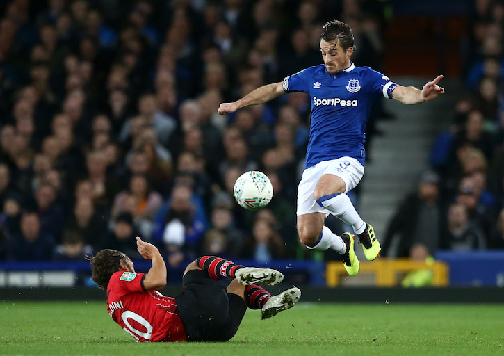 Leighton Baines of Everton jumps clear of a challenge from Manolo Gabbiadini of Southampton during the Carabao Cup Third Round match between Everton and Southampton at Goodison Park on October 2, 2018 in Liverpool, England. PHOTO: Jan Kruger/Getty Images