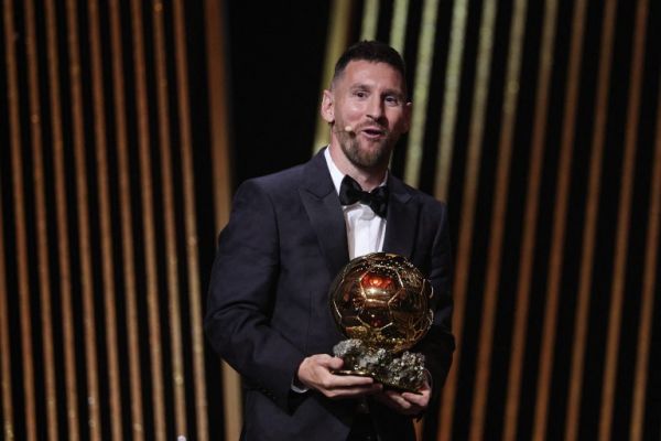 Lionel Messi holding his eighth Ballon d'Or.  PHOTO| AFP