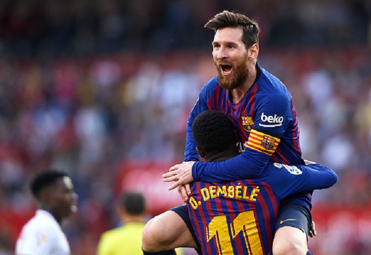 Lionel Messi of Barcelona celebrates after scoring his team's second goal with his teammate Ousmane Dembele during the La Liga match between Sevilla FC and FC Barcelona at Estadio Ramon Sanchez Pizjuan on February 23, 2019 in Seville, Spain. PHOTO/GettyImages