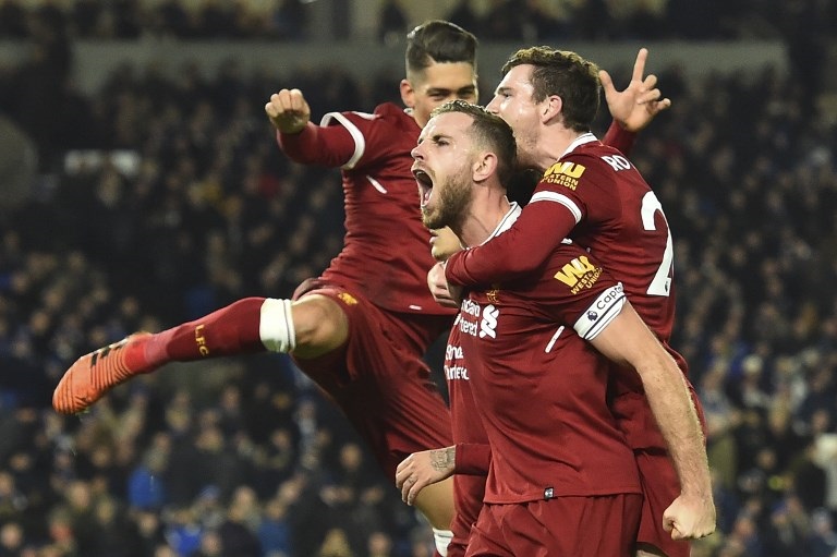 Liverpool FC skipper, Jordan Henderson (centre) celebrates a goal in a previous EPL clash. PHOTO/File
