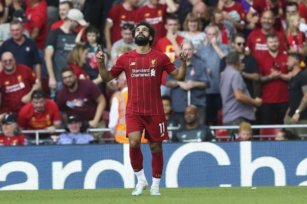 Liverpool forward Mohamed Salah (11) celebrates his goal 3-0 during the Premier League match between Liverpool and Arsenal at Anfield, Liverpool, England on 24 August 2019. PHOTO | AFP