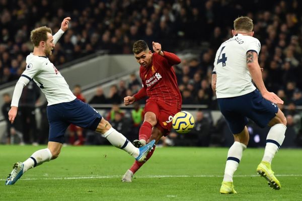 Liverpool's Brazilian midfielder Roberto Firmino (2L) shoots but sees his shot saved during the English Premier League football match between Tottenham Hotspur and Liverpool at Tottenham Hotspur Stadium in London, on January 11, 2020. PHOTO | AFP