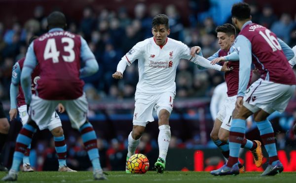 Liverpool's Brazilian midfielder Roberto Firmino vies with the Villa defence during the English Premier League football match between Aston Villa and Liverpool at Villa Park in Birmingham, central England on February 14, 2016. PHOTO | AFP