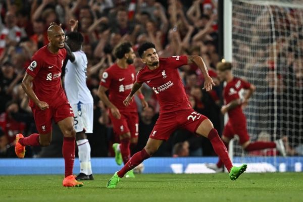 Liverpool's Colombian midfielder Luis Diaz (C) celebrates after scoring his team first goal during the English Premier League football match between Liverpool and Crystal Palace at Anfield stadium, in Liverpool, north west England on August 15, 2022. PHOTO | AFP