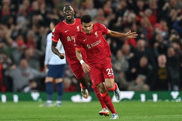 Liverpool's Colombian midfielder Luis Diaz (R) celebrates after scoring their first goal during the English Premier League football match between Liverpool and Tottenham Hotspur at Anfield in Liverpool, north west England on May 7, 2022. PHOTO | AFP