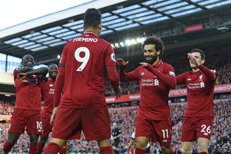 Liverpool's Egyptian midfielder Mohamed Salah (2nd R) celebrates with teammates after scoring their third goal during the English Premier League football match between Liverpool and Bournemouth at Anfield in Liverpool, north west England on February 9, 2019. PHOTO/AFP