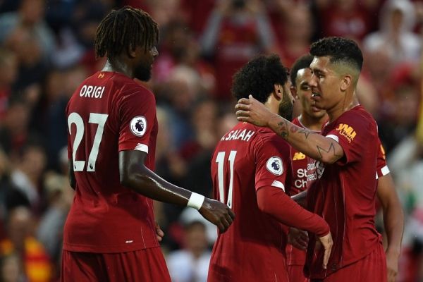 Liverpool's Egyptian midfielder Mohamed Salah (C) with Liverpool's Brazilian midfielder Roberto Firmino (R) celebrates after scoring the team's second goal during the English Premier League football match between Liverpool and Norwich City at Anfield in Liverpool, north west England on August 9, 2019. PHOTO | AFP