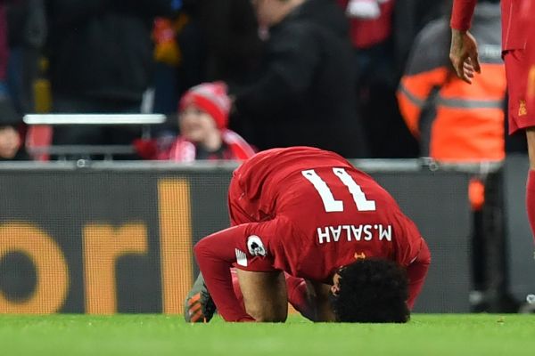 Liverpool's Egyptian midfielder Mohamed Salah celebrates after scoring their second goal during the English Premier League football match between Liverpool and Manchester City at Anfield in Liverpool, north west England on November 10, 2019. PHOTO | AFP