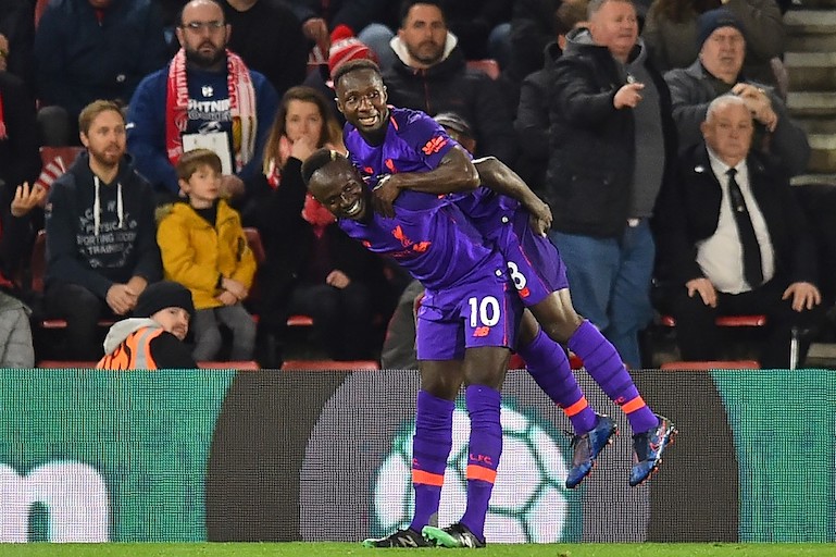 Liverpool's Guinean midfielder Naby Keita (right) celebrates with Liverpool's Senegalese striker Sadio Mane (L) after scoring their first goal during the English Premier League football match between Southampton and Liverpool at St Mary's Stadium in Southampton, southern England on April 5, 2019. PHOTO/AFP