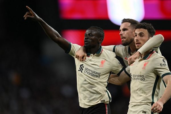 Liverpool's Senegalese striker Sadio Mane (L) celebrates scoring the team's second goal with Liverpool's English midfielder Jordan Henderson (C) and Liverpool's Portuguese striker Diogo Jota during the English Premier League football match between Aston Villa and Liverpool at Villa Park in Birmingham, central England on May 10, 2022. PHOTO | AFP