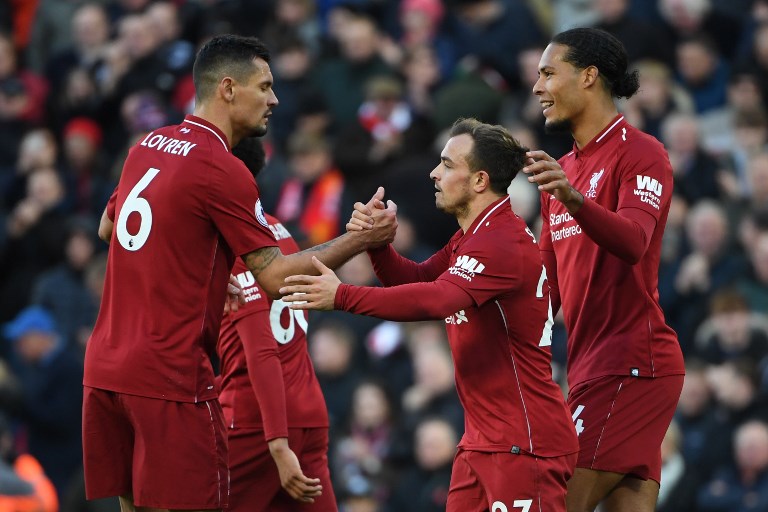 Liverpool's Swiss midfielder Xherdan Shaqiri (C) celebrates scoring their third goal during the English Premier League football match between Liverpool and Cardiff City at Anfield in Liverpool, north west England on October 27, 2018. PHOTO/AFP