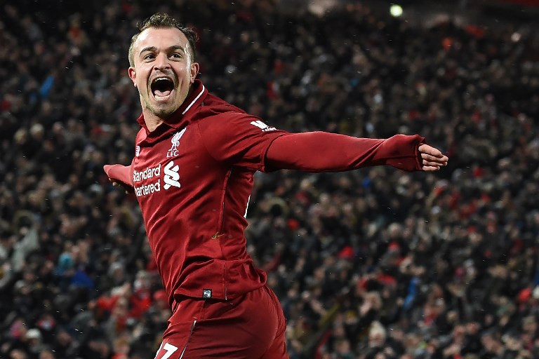 Liverpool's Swiss midfielder Xherdan Shaqiri celebrates after scoring their third goal during the English Premier League football match between Liverpool and Manchester United at Anfield in Liverpool, north west England on December 16, 2018. PHOTO/AFP