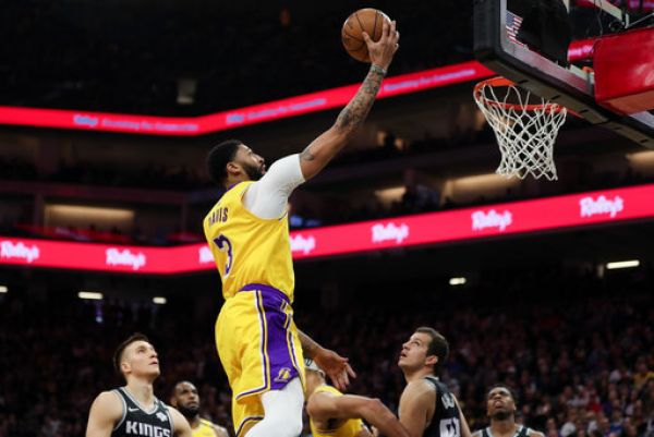 Los Angeles Lakers forward Anthony Davis (3) shoots the ball past Sacramento Kings guard Bogdan Bogdanovic (8) during the first quarter at Golden 1 Center. PHOTO | PA Images