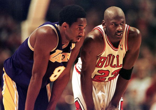 Los Angeles Lakers guard Kobe Bryant(L) and Chicago Bulls guard Michael Jordan(R) talk during a free-throw attempt during the fourth quarter 17 December at the United Center in Chicago. Bryant, who is 19 and bypassed college basketball to play in the NBA, scored a team-high 33 points off the bench, and Jordan scored a team-high 36 points. The Bulls defeated the Lakers 104-83. PHOTO | AFP