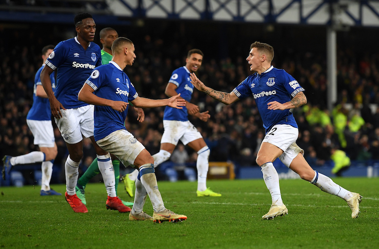 Lucas Digne (right) runs towards his Everton FC teammates after scoring a last-gasp equaliser in their English Premier League clash at Goodison Park on December 10, 2018. PHOTO/Everton FC