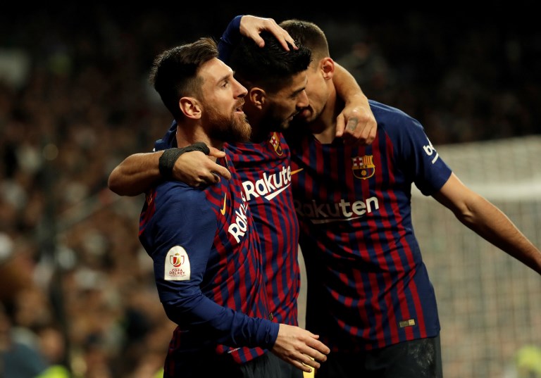 Luis Suarez of Barcelona celebrates with his team mates after scoring a goal during the Copa del Rey Semi Final second leg match between Real Madrid and FC Barcelona at Santiago Bernabeu Stadium on February 27, 2019 in Madrid, Spain. PHOTO/AFP