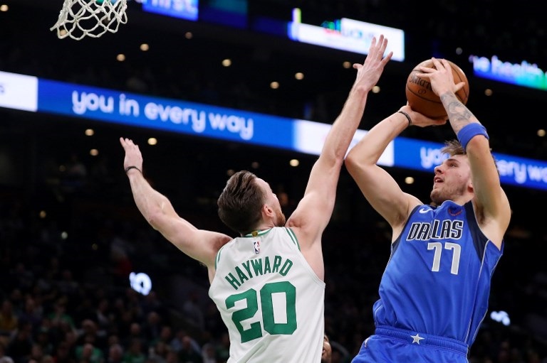 Luka Doncic (right) of the Dallas Mavericks takes a shot over Gordon Hayward #20 of the Boston Celtics during the first half at TD Garden on January 04, 2019 in Boston, Massachusetts. PHOTO/AFP