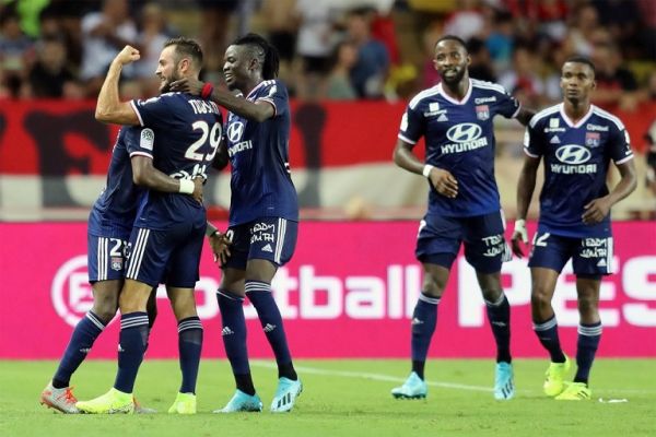 Lyon's French midfielder Lucas Tousart (L) celebrates after scoring the 0-3 goal during the French L1 football match between AS Monaco (ASM) and Olympique Lyonnais (OL) at the Stade Louis II stadium in Monaco on August 9, 2019. PHOTO | AFP