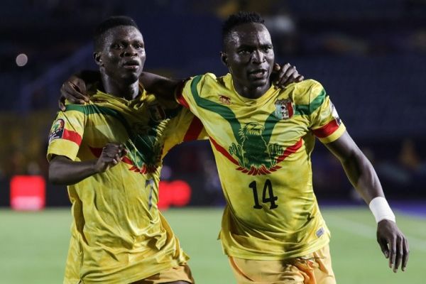 Mali's Adama Traore (R) celebrates scoring his side's fourth with teammate Moussa Doumbia during the 2019 Africa Cup of Nations Group E soccer match between Mali and Mauritania at the Suez Sports Stadium. PHOTO | AFP