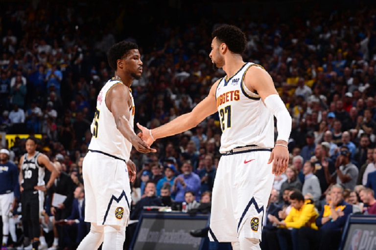 Malik Beasley #25 hi-fives Jamal Murray #27 of the Denver Nuggets during Game Two of Round One of the 2019 NBA Playoffs on on April 16, 2019 at the Pepsi Center in Denver, Colorado.PHOTO/GETTY IMAGES