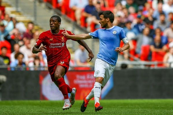Manchester City midfielder David Silva (21) tussles with Liverpool midfielder Georginio Wijnaldum (5) during the FA Community Shield match between Liverpool and Manchester City at Wembley Stadium, London, England on August 4, 2019. PHOTO | AFP