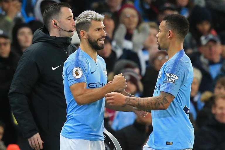 Manchester City's Argentinian striker Sergio Aguero (L) comes on to replace Manchester City's Brazilian striker Gabriel Jesus (R) during the English Premier League football match between Manchester City and Wolverhampton Wanderers at the Etihad Stadium in Manchester, north west England, on January 14, 2019. PHOTO/AFP