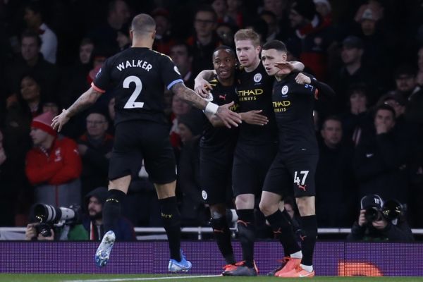 Manchester City's Belgian midfielder Kevin De Bruyne (2nd R) celebrates with teammates after scoring the opening goal of the English Premier League football match between Arsenal and Manchester City at the Emirates Stadium in London on December 15, 2019. PHOTO | AFP