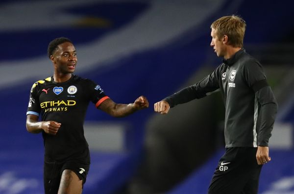 Manchester City's English midfielder Raheem Sterling (L) fist pumps Brighton's English manager Graham Potter after the English Premier League football match between Brighton and Hove Albion and Manchester City at the American Express Community Stadium in Brighton, southern England on July 11, 2020. PHOTO | AFP