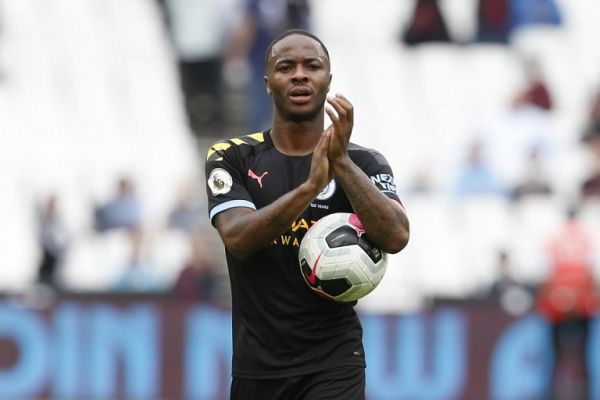 Manchester City's English midfielder Raheem Sterling applauds as he carries the match ball after scoring a hatttick to help his team win 5-0 during the English Premier League football match between West Ham United and Manchester City at The London Stadium, in east London on August 10, 2019. PHOTO | AFP