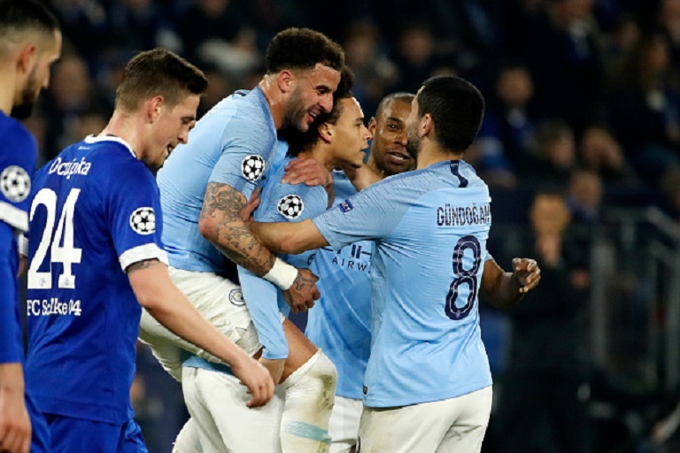 Manchester City's German midfielder Leroy Sane (C) is congratulated by teammates after scoring a goal during the UEFA Champions League round of 16 first leg football match between Schalke 04 and Manchester City on February 20, 2019 in Gelsenkirchen, Germany. PHOTO/AFP