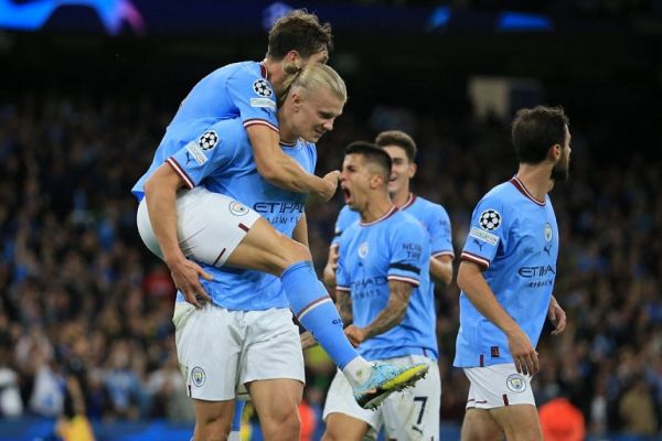 Manchester City's Norwegian striker Erling Haaland (2nd-L) celebrates his goal with teammates during the UEFA Champions League group G football match between England's Manchester City and Germany's Borussia Dortmund at the Etihad Stadium in Manchester on September 14, 2022. PHOTO | AFP