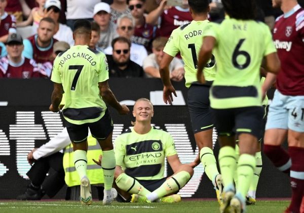 Manchester City's Norwegian striker Erling Haaland (C) celebrates after scoring the opening goal from the penalty spot during the English Premier League football match between West Ham United and Manchester City at the London Stadium, in London on August 7, 2022. PHOTO | AFP