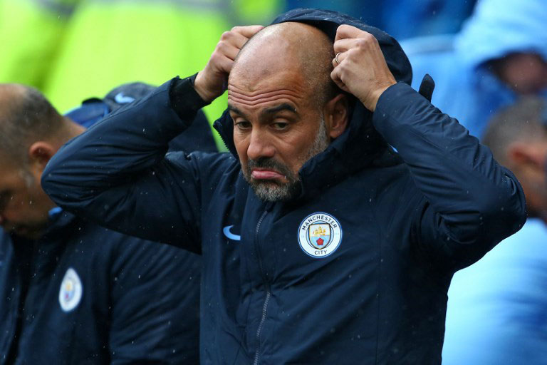 Manchester City's Spanish manager Pep Guardiola gestures as he awaits kick off in the English Premier League football match between between Cardiff City and Manchester City at Cardiff City Stadium in Cardiff, south Wales on September 22, 2018.  Geoff CADDICK / AFP