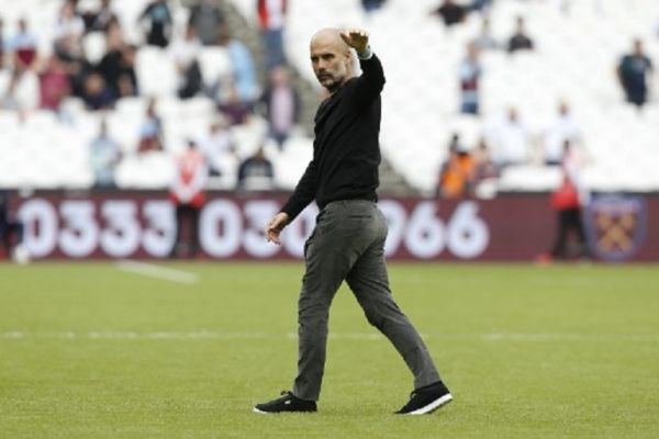 Manchester City's Spanish manager Pep Guardiola waves at the end of the English Premier League football match between West Ham United and Manchester City at The London Stadium, in east London on August 10, 2019. PHOTO/ AFP