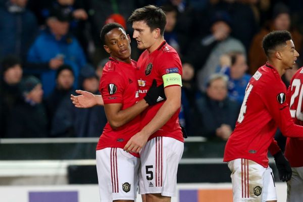 Manchester United's Anthony Martial celebrates with Manchester United's captain Harry Maguire after scoring during a game of the 1/16 finals of the UEFA Europa League between Belgian soccer club Club Brugge and English club Manchetser United, in Brugge, Thursday 20 February 2020.  PHOTO | AFP