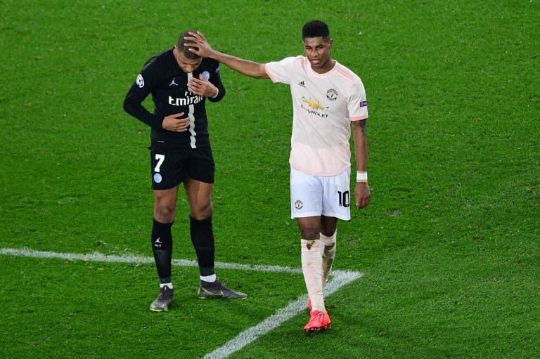 Manchester United's English forward Marcus Rashford (R) interacts with Paris Saint-Germain's French forward Kylian Mbappe at the end of the UEFA Champions League round of 16 second-leg football match between Paris Saint-Germain (PSG) and Manchester United at the Parc des Princes stadium in Paris on March 6, 2019. PHOTO/AFP