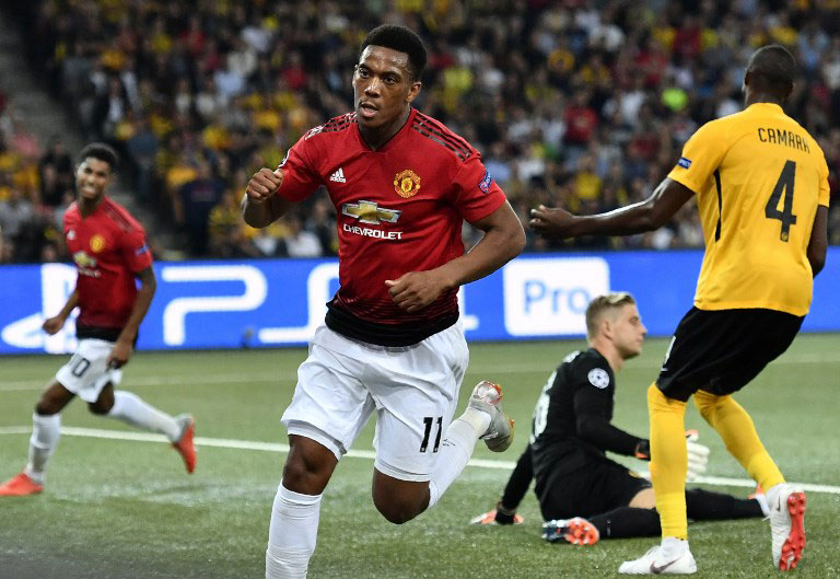 Manchester United's French striker Anthony Martial (C) celebrates after scoring during the UEFA Champions League group H football match between Young Boys and Manchester United at The Stade de Suisse in Bern on September 19, 2018. PHOTO/AFP