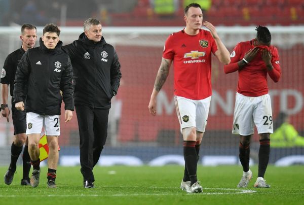 Manchester United's Norwegian manager Ole Gunnar Solskjaer (3L) leaves the pitch with Manchester United's Welsh midfielder Daniel James (2L), Manchester United's English defender Phil Jones (2R) and Manchester United's English defender Aaron Wan-Bissaka after the English Premier League football match between Manchester United and Burnley at Old Trafford in Manchester, north west England, on January 22, 2020. Burnley won the match 2-0. PHOTO | AFP