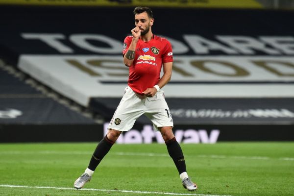 Manchester United's Portuguese midfielder Bruno Fernandes celebrates after scoring their first goal from the penalty spot during the English Premier League football match between Tottenham Hotspur and Manchester United at Tottenham Hotspur Stadium in London, on June 19, 2020. PHOTO | AFP