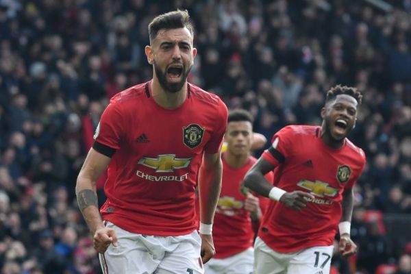Manchester United's Portuguese midfielder Bruno Fernandes celebrates scoring the opening goal from the penalty spot during the English Premier League football match between Manchester United and Watford at Old Trafford in Manchester, north west England, on February 23, 2020. PHOTO | AFP