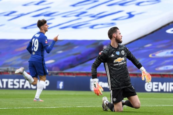 Manchester United's Spanish goalkeeper David de Gea (R) reacts as Chelsea's English midfielder Mason Mount (L) celebrates after scoring their second goal during the English FA Cup semi-final football match between Manchester United and Chelsea at Wembley Stadium in London, on July 19, 2020. PHOTO | AFP