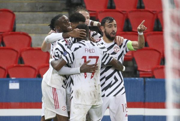 Marcus Rashford of Manchester United celebrates his goal with Aaron Wan-Bissaka (left), Bruno Fernandes (right) and teammates during the UEFA Champions League, Group Stage, Group H football match between Paris Saint-Germain (PSG) and Manchester United (Man U) on October 20, 2020 at Parc des Princes stadium in Paris, France. PHOTO | AFP