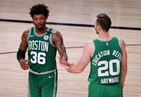 Marcus Smart #36 of the Boston Celtics and Gordon Hayward #20 of the Boston Celtics react during the fourth quarter against the Miami Heat in Game Three of the Eastern Conference Finals during the 2020 NBA Playoffs at AdventHealth Arena at the ESPN Wide World Of Sports Complex on September 19, 2020 in Lake Buena Vista, Florida. PHOTO | AFP