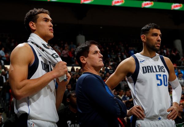 Mark Cuban, owner of the Dallas Mavericks, looks on with Dwight Powell #7 and Salah Mejri #50 in the final seconds of their 112-107 loss to the Atlanta Hawks at Philips Arena on December 23, 2017 in Atlanta, Georgia. PHOTO | AFP