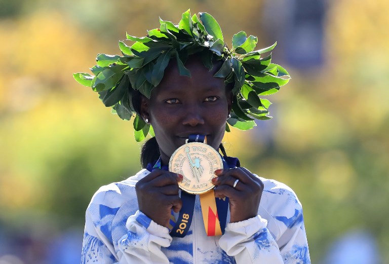 Mary Keitany of Kenya poses with her first place medal at the finish line during the 2018 TCS New York City Marathon on November 4, 2018 in Central Park in New York City. PHOTO/AFP  