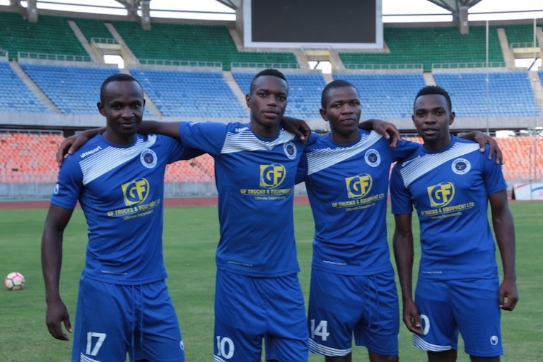 Mbao FC players, Mwassa (captain), Said Khamis (top scorer), Pastory Athanasi and Evarigestus Mujwahuki pose at the venue of the 2019 SportPesa Cup, National Stadium in Dar ahead of the regional knockout tournament that will run from January 22-27. PHOTO/SPN