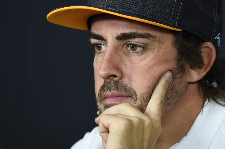 McLaren's Spanish driver Fernando Alonso looks on during a press conference at the Circuit Paul Ricard in Le Castellet, southern France. Fernando Alonso will retire from Formula 1 at the end of the season McLaren announced on August 14, 2018. PHOTO/AFP