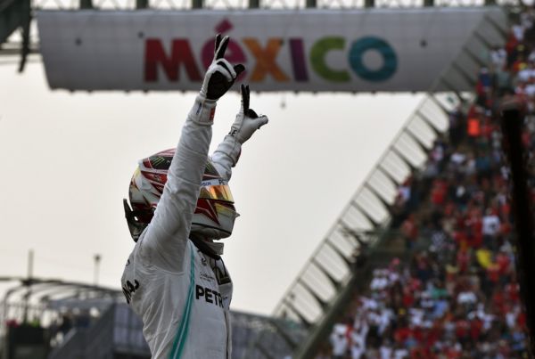 Mercedes' British driver Lewis Hamilton celebrates after winning the F1 Mexico Grand Prix, at the Hermanos Rodriguez racetrack in Mexico City on October 27, 2019. Lewis Hamilton won the Mexican Grand Prix on Sunday, but will have to wait for his sixth world title after Mercedes teammate Valtteri Bottas came home in third. PHOTO | AFP